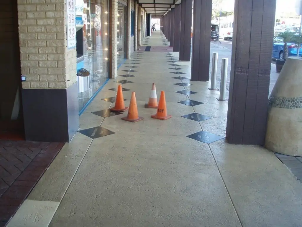 new flooring outdoors with cones to stop people walking