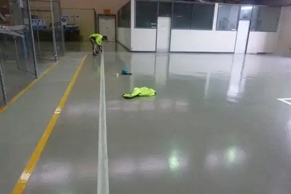 applying safety lines on flooring