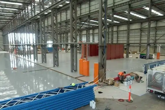 work in progress on flooring large industrial unit